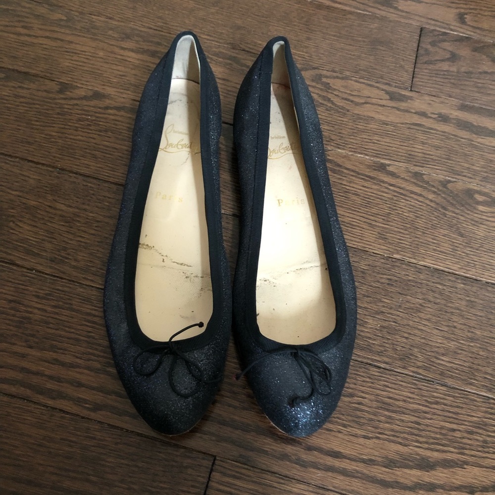 Louboutin black flat shoe